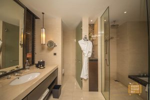 Bathroom with separate shower and bath in Room 1706 at Fairmont Jakarta