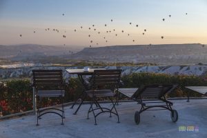 Enjoy a cuppa coffee during sunrise as you overlook the hot air balloons rising at Ariana Sustainable Luxury Lodge in Cappadocia, Turkey