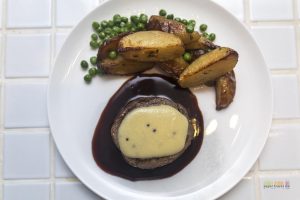 Qantas First Class Menu - Beef fillet with rosemary potatoes, green peas and mustard