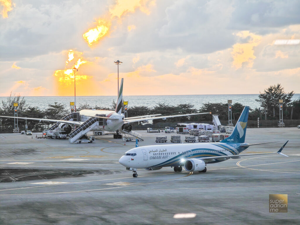 Oman Air in Phuket International Airport during sunset on 8 June 2024