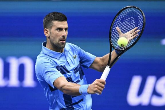 NEW YORK, UNITED STATES - AUGUST 26: Novak Djokovic of Serbia in action against Radu Albot (not seen) of Moldova during Men's Singles First Round match on Day One of the 2024 US Open at the USTA Billie Jean King National Tennis Center in New York, United States on August 26, 2024. (Photo by Fatih Aktas /Anadolu via Getty Images)