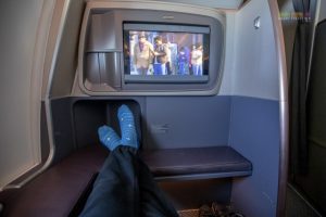 Business Class seats which do not have any seats in front of them have more leg room space.