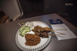 Singapore Chicken and Beef Satay with onion, cucumber and spicy peanut sauce