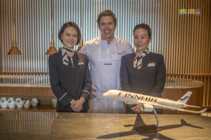 Chef Tommy Myllmäki flanked by two Finnair flight attendants at a media event at Lounge by the Pool in Conrad Centennial Singapore on 30 May 2019