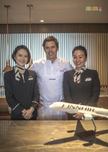 Chef Tommy Myllmäki flanked by two Finnair flight attendants at a media event at Lounge by the Pool in Conrad Centennial Singapore on 30 May 2019