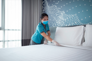 As part of the “ONYX Clean” initiative, a room seal will be placed on every guest room door to indicate to arriving guests that their personal space has not been tampered with since being thoroughly cleaned and disinfected. Photo shows a housekeeping team member servicing a room at Shama Lakeview Asoke Bangkok.